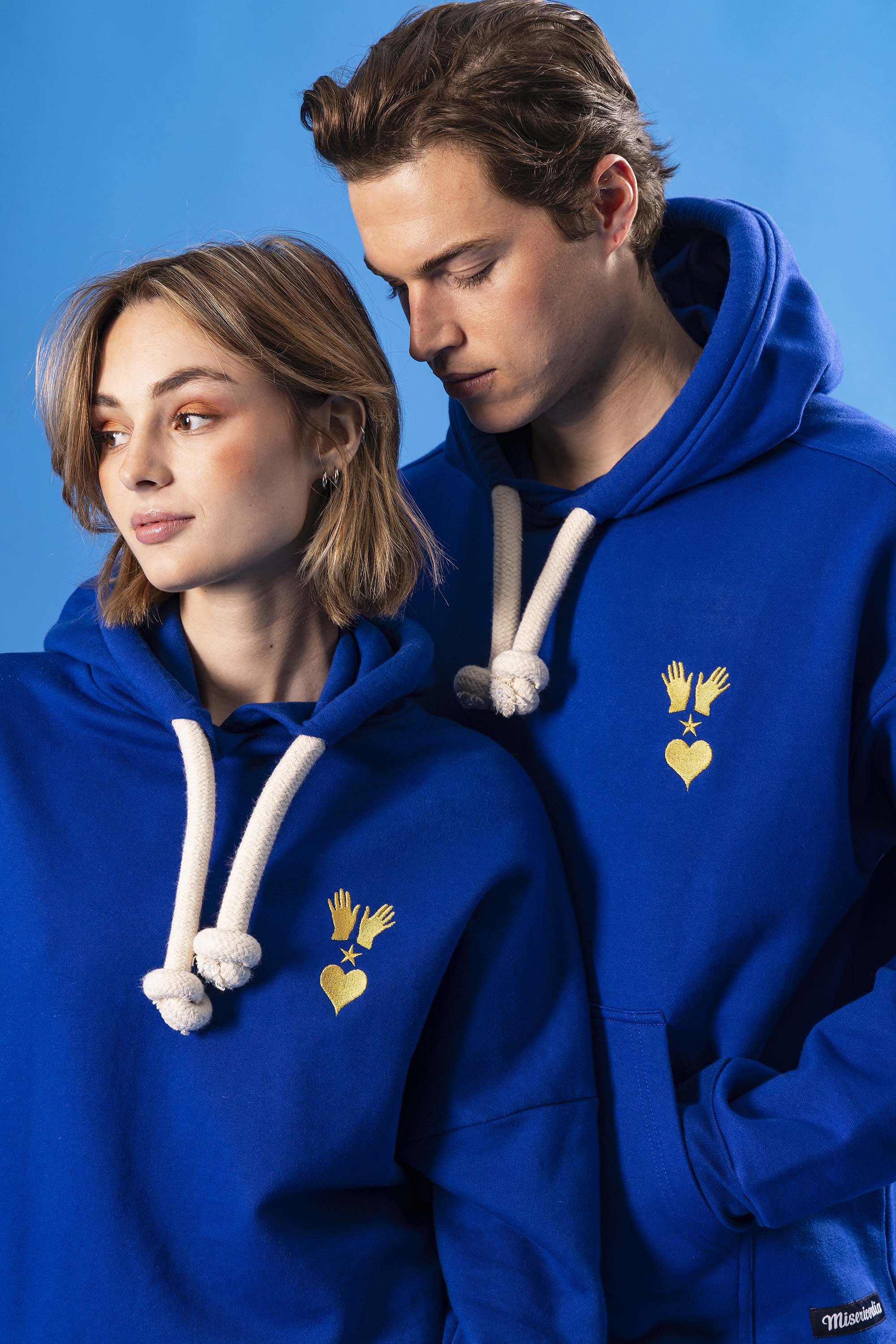 Loose sapphire blue cotton hoodie with embroidery on the front and wide drawstrings