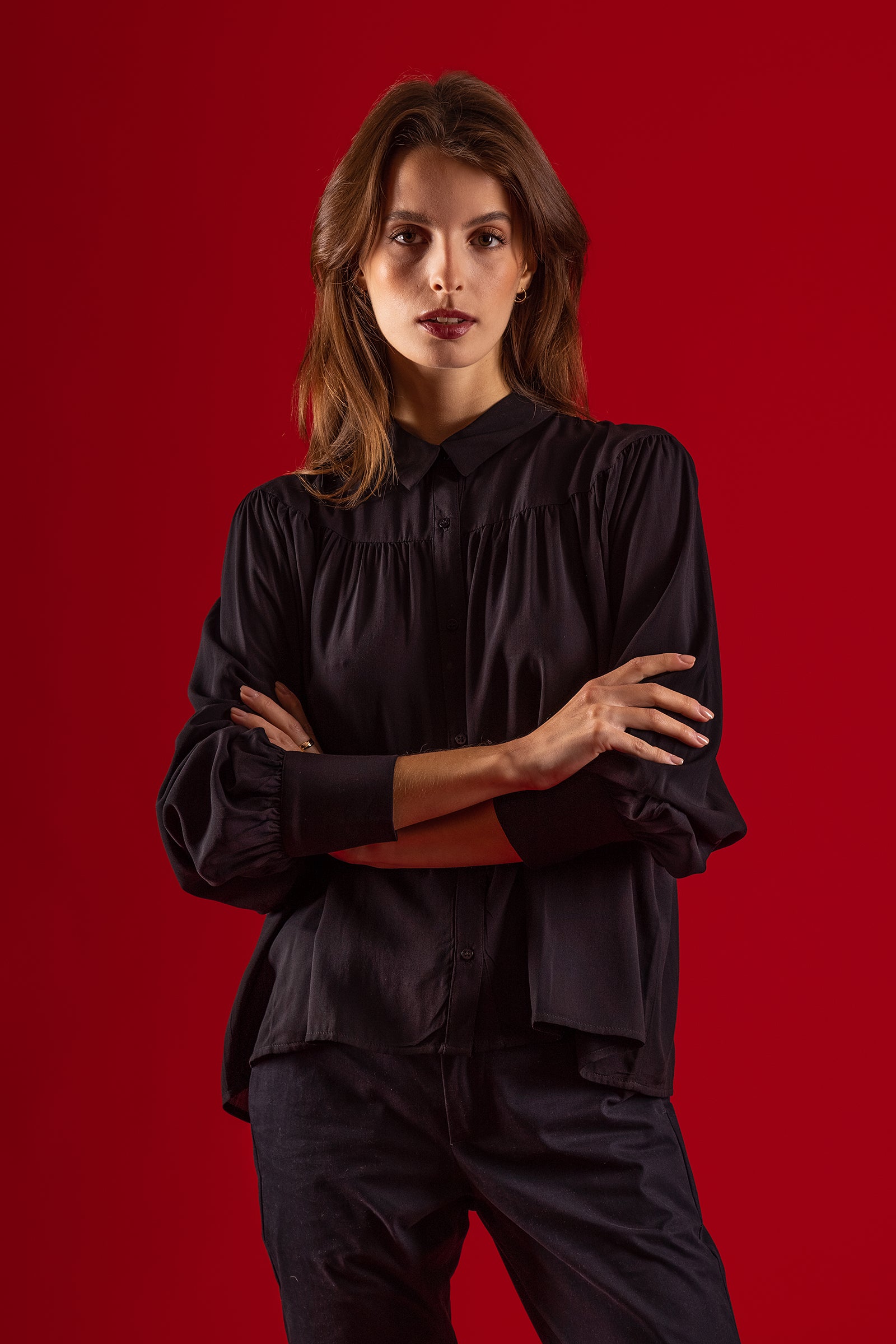 woman wearing sophisticated button down collar black shirt female cotton elegant shiny red background blouse misericordia lima peru