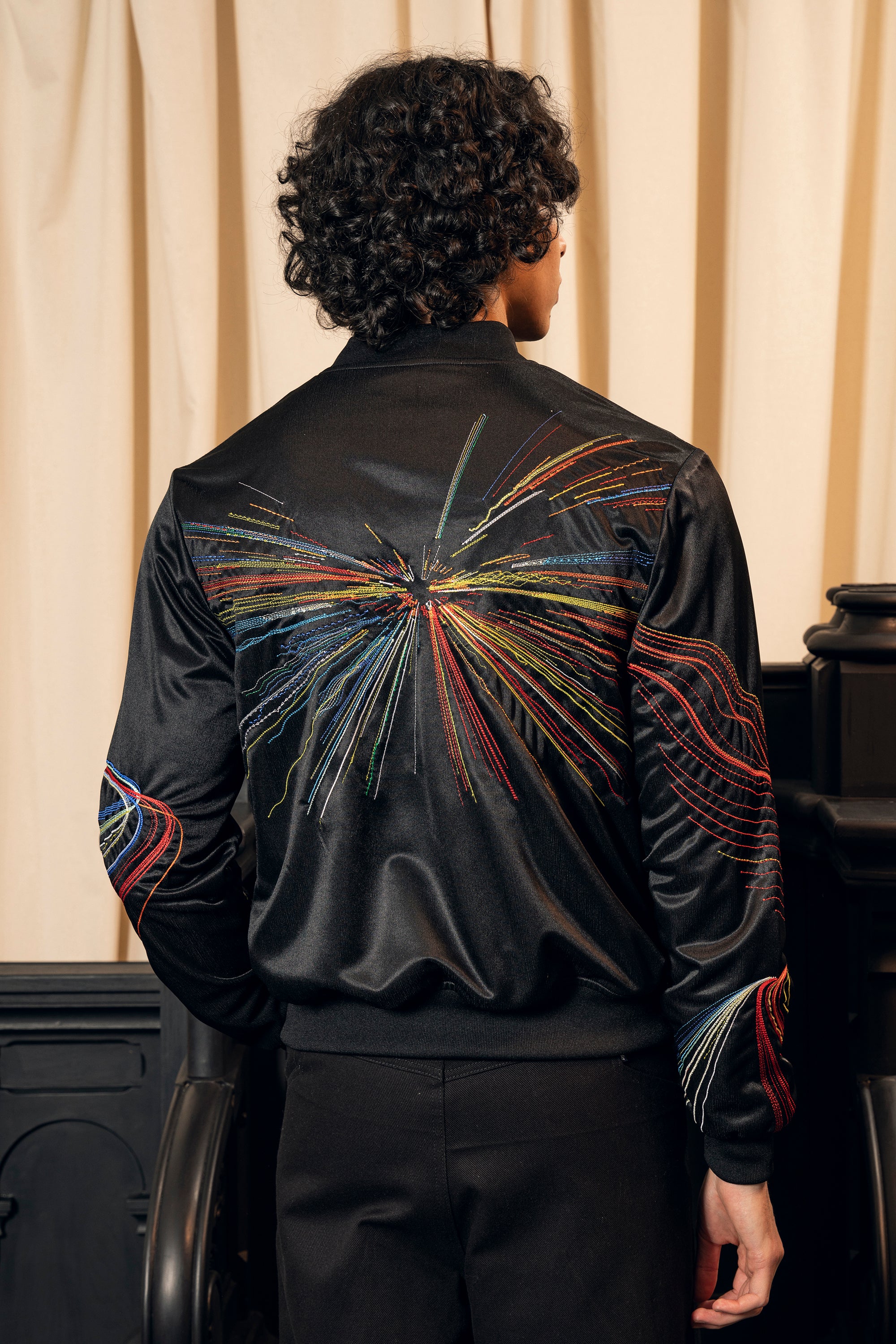 light graphic sports jacket ethical fashion artisanal manufacturing colorful embroidery urban heritage and sportswear