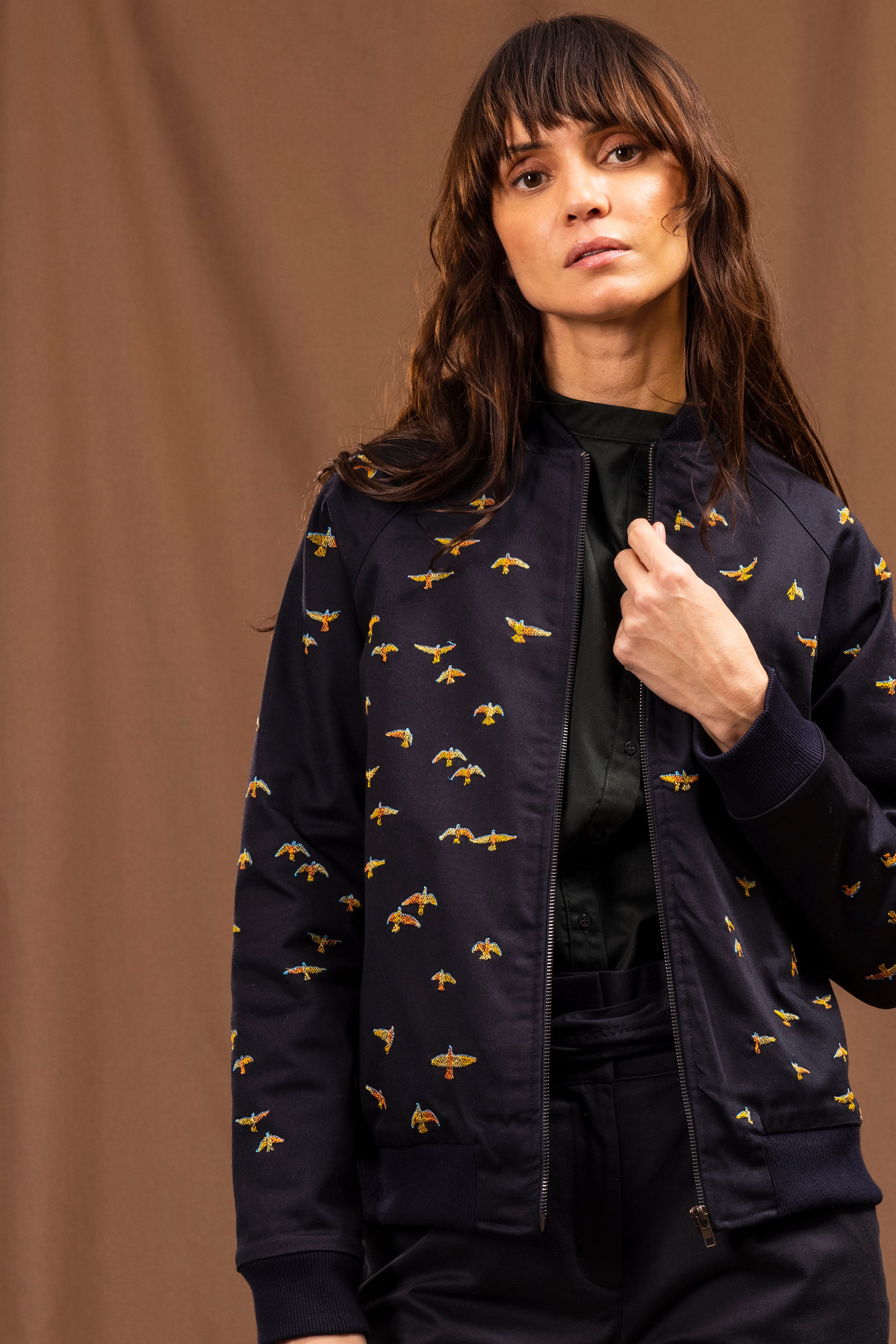 Navy blue zipped jacket with all-over bird embroidery