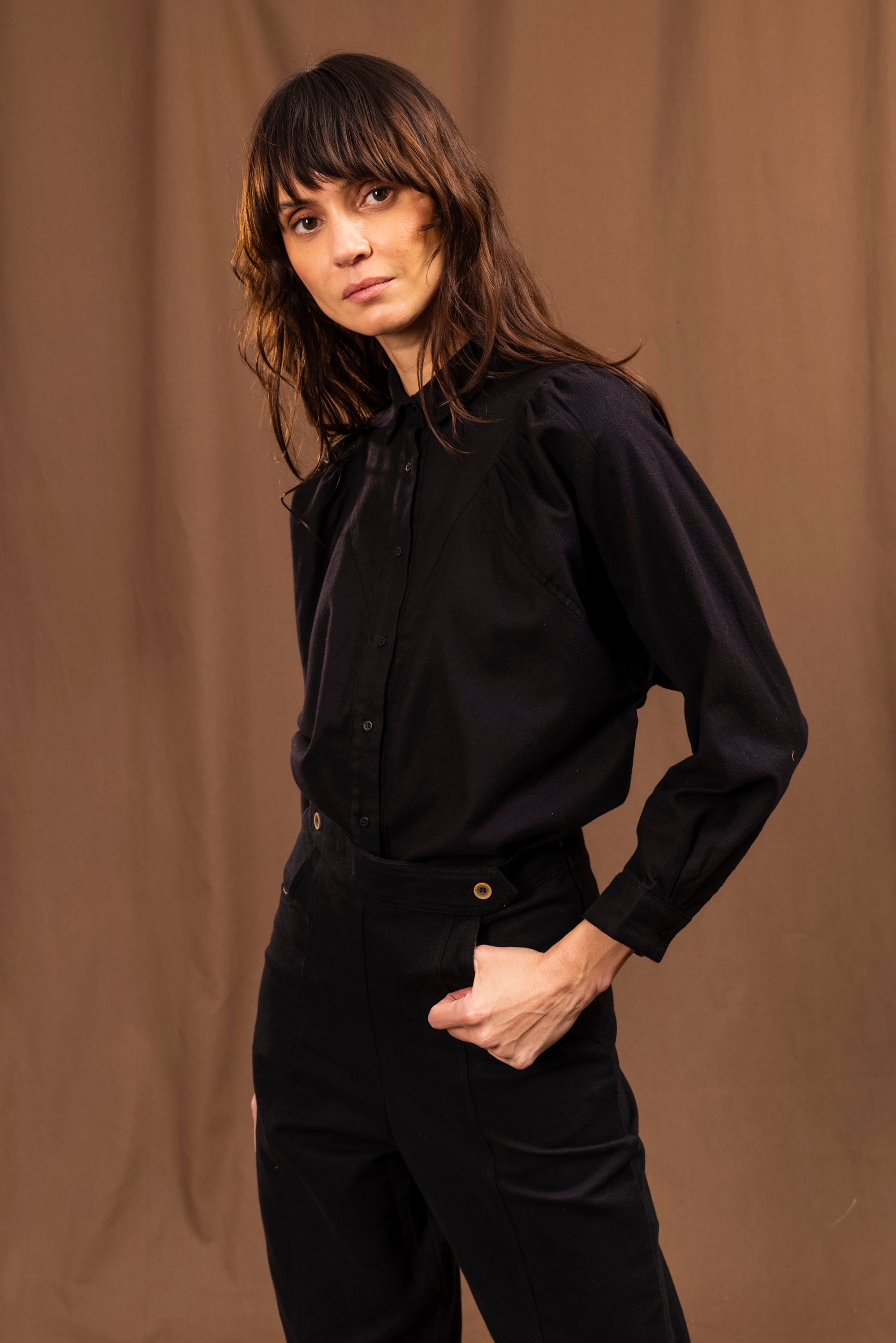 black buttoned bib effect shirt with batwing effect balloon sleeves