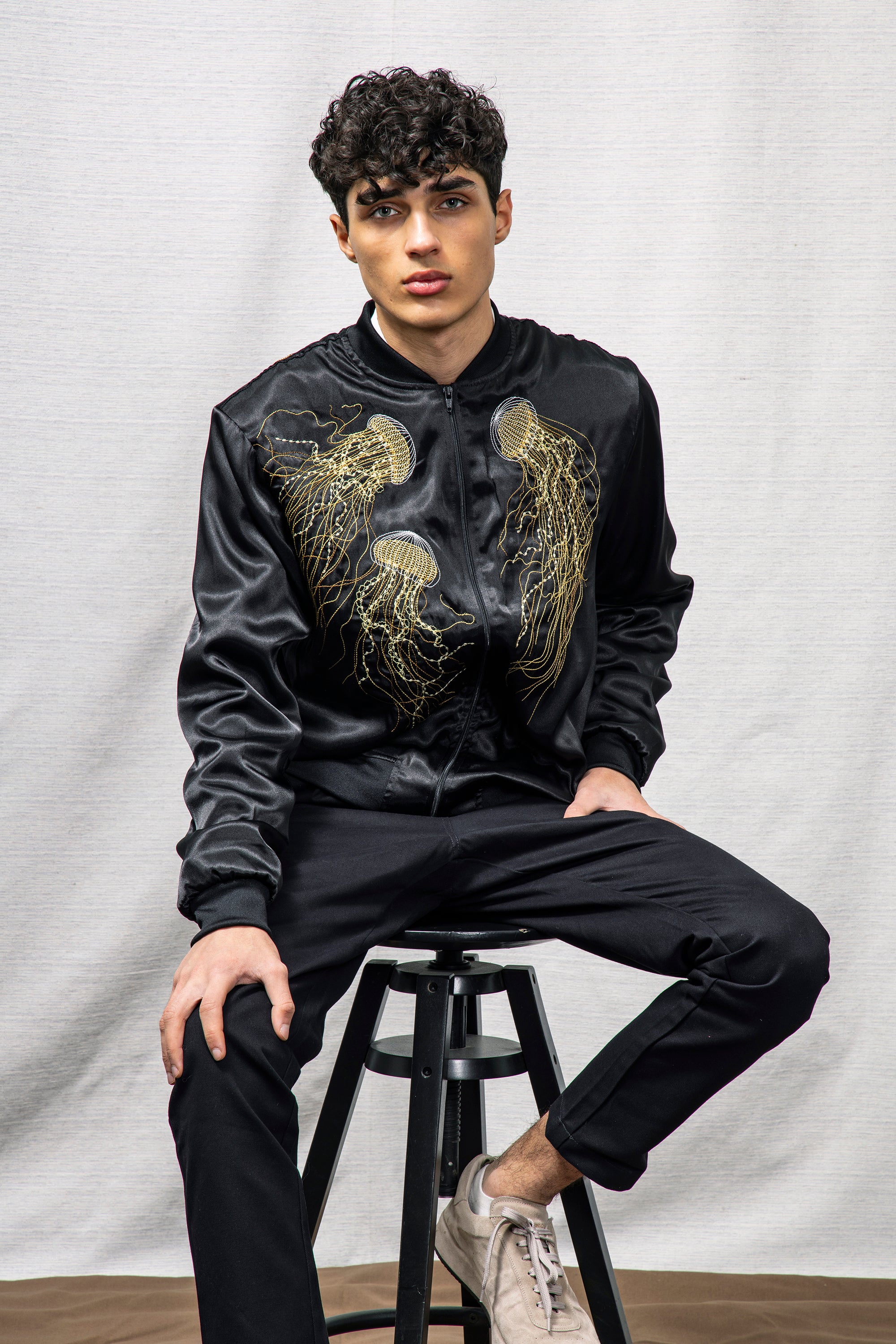 satin bomber jacket for men mid season summer spring Peruvian cotton artisanal black and gold embroidery jellyfish soft and graphic marine patterns