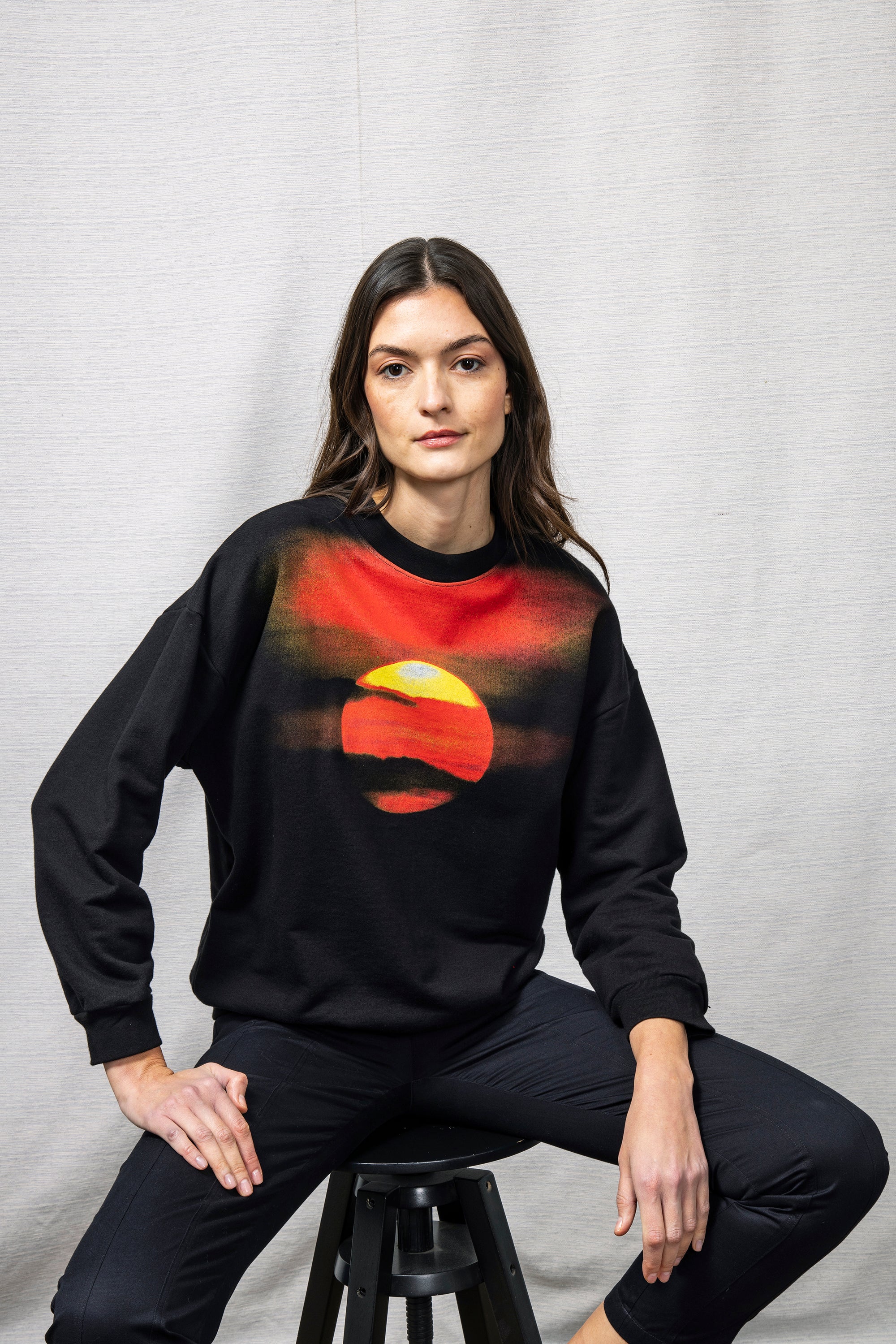 soft and light mid-season black cotton sweater Peruvian hand-made screen printing sunset pattern bright but sober colors avant-garde graphics