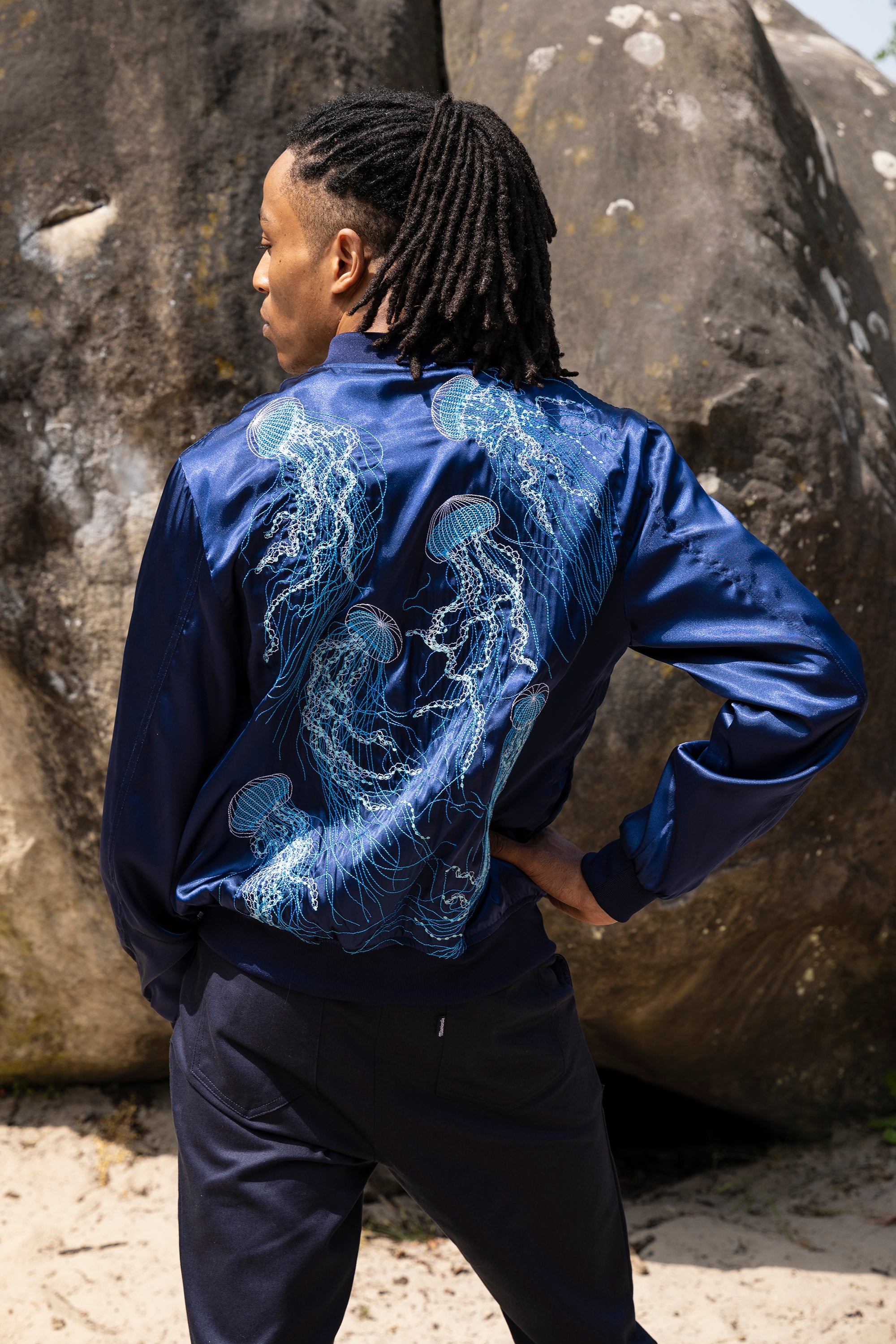 navy blue zipped bomber jacket with jellyfish embroidery on the back and front