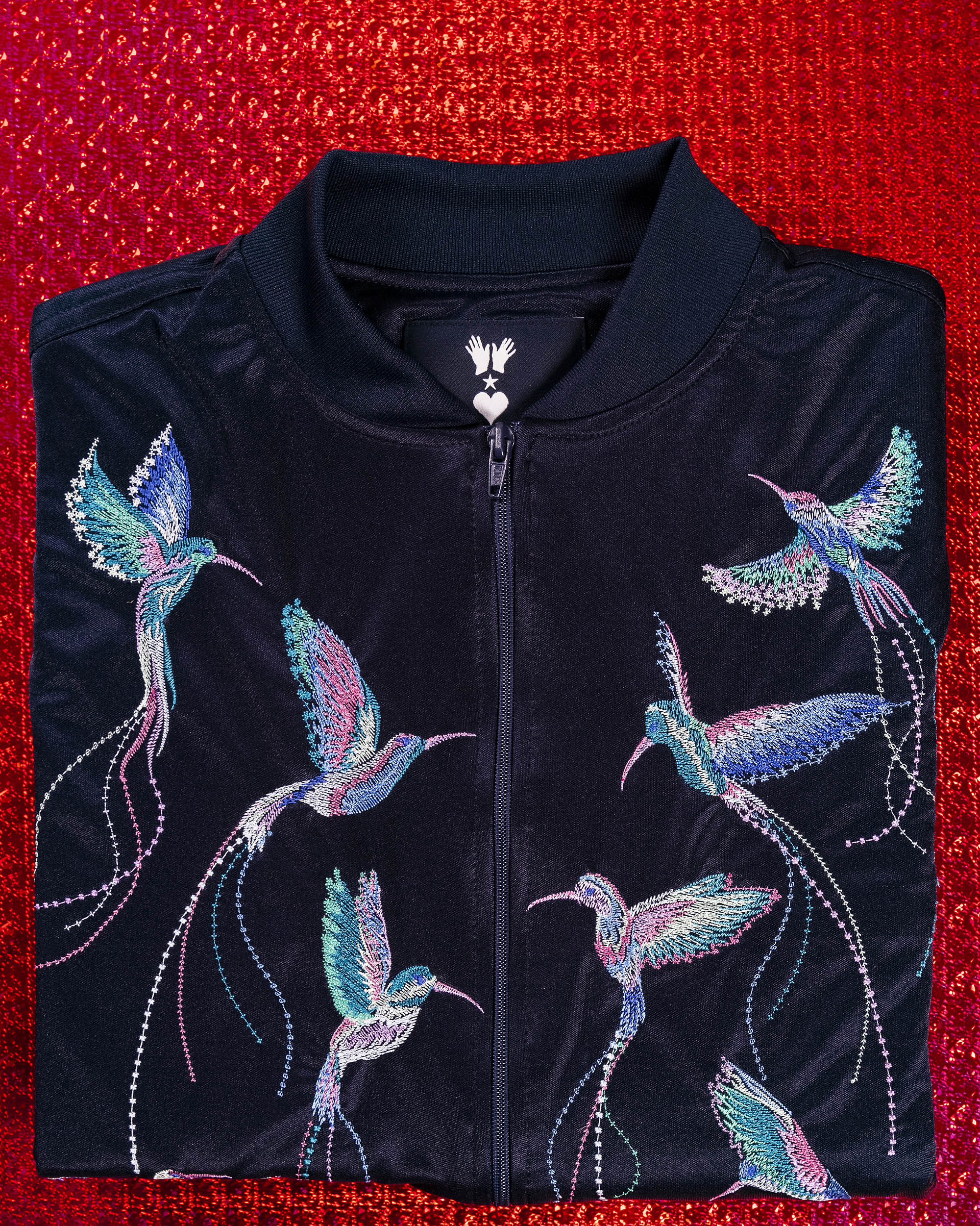 navy blue souvenir bomber jacket with hummingbird embroidery on the back gift idea for christmas misericordia