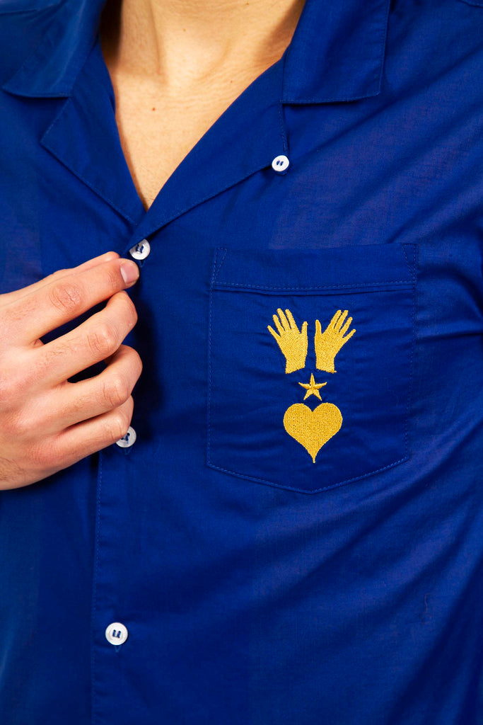 embroidered shirt with heart hands and electric blue spirit