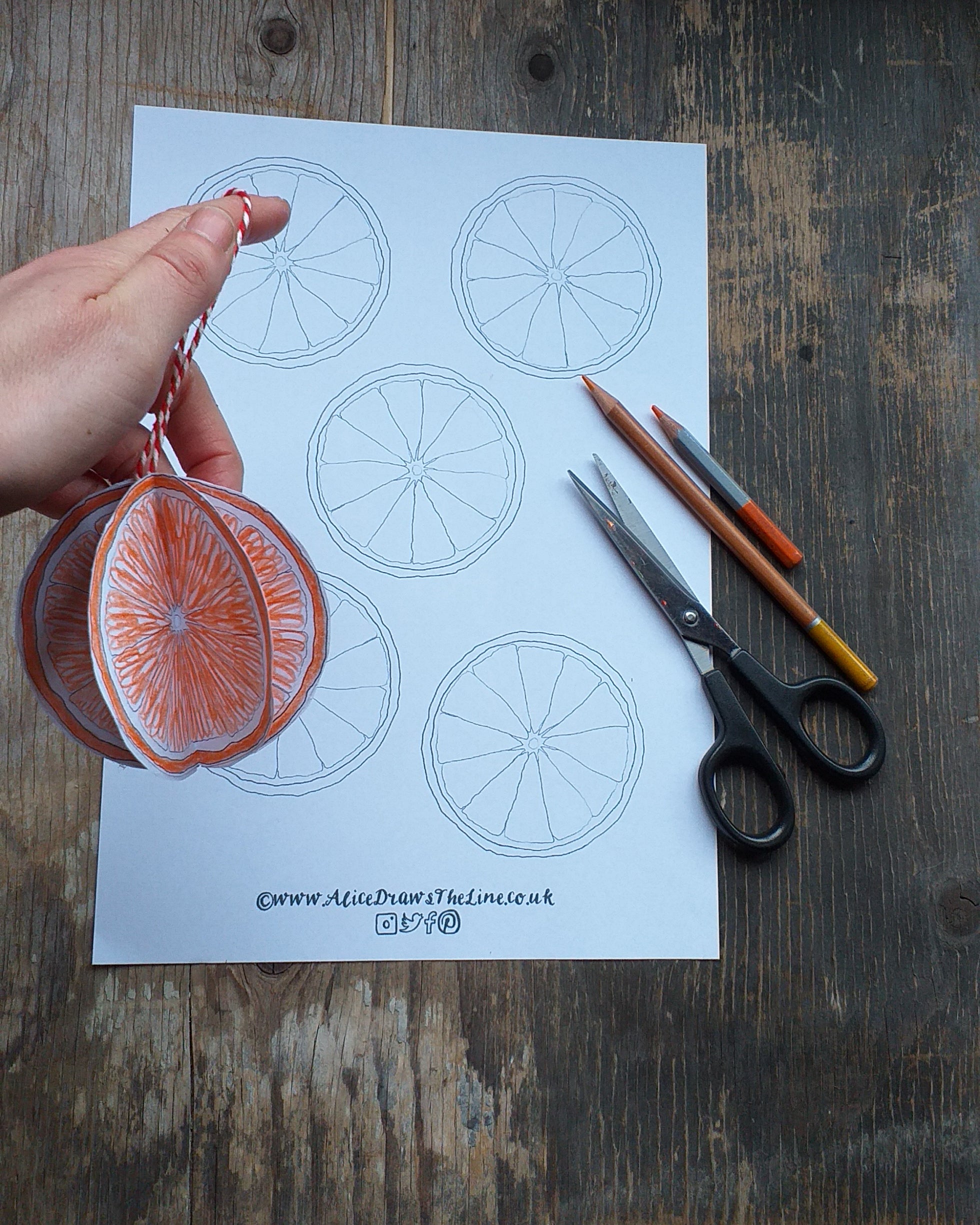 Making a festive paper bauble by Alice Draws the Line, a paper orange to hang on the tree