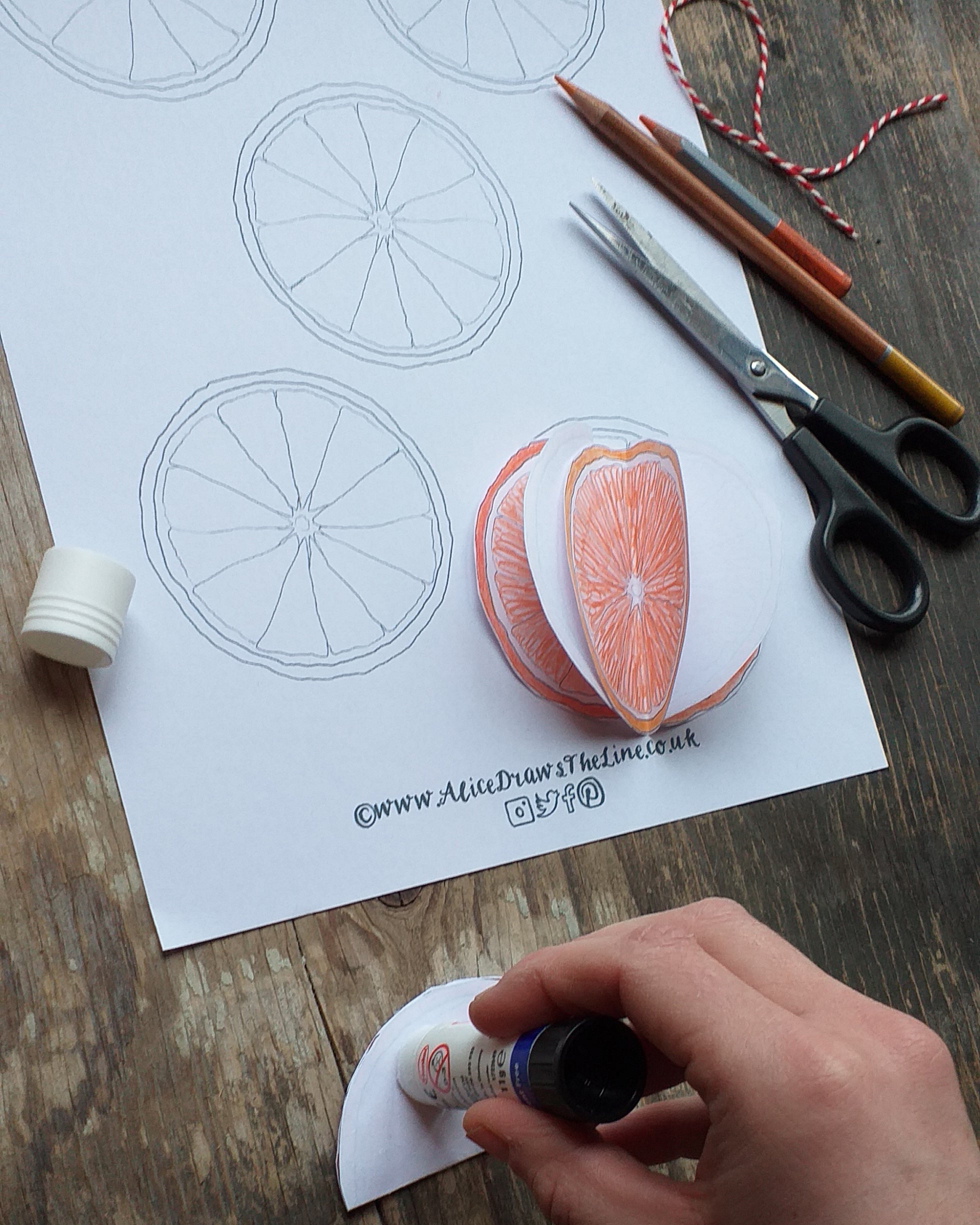 Make a festive bauble at home, a sliced orange bauble decoration by Alice Draws the Line