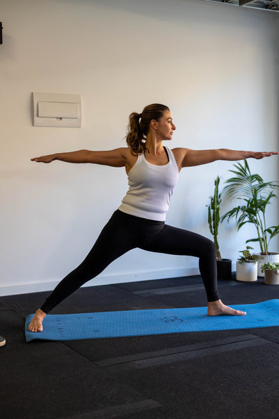 Woman Doing Yoga Pose - Virabhadrasana II