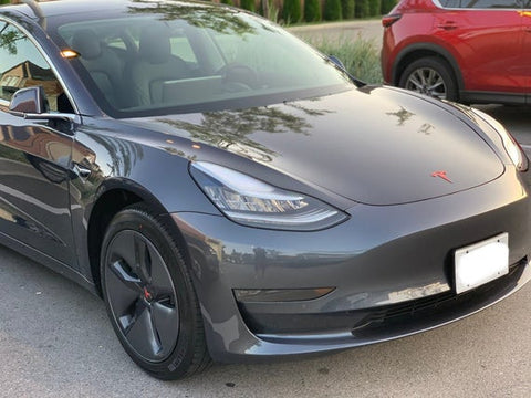 Grey Tesla X with Red Tesla Logo