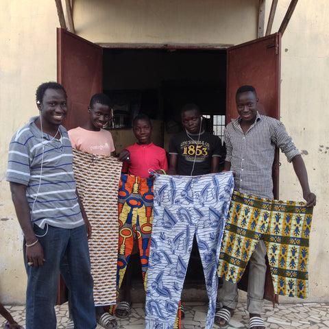 Omar and his tailoring team in Sukuta