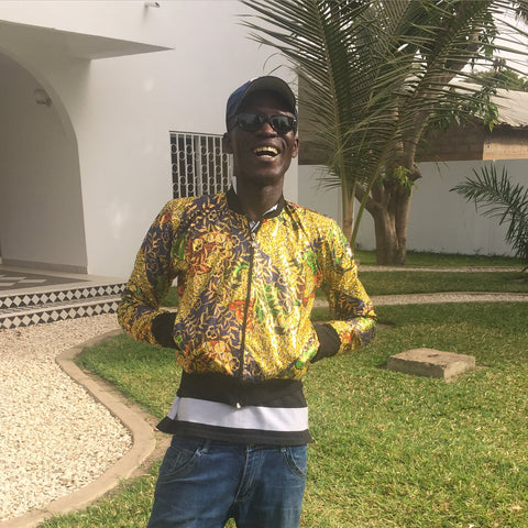 Ethical Clothing, Adama, our Gambian manager wearing one of our bomber jackets