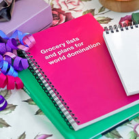 A pink WTF Notebook in a gift giving setting