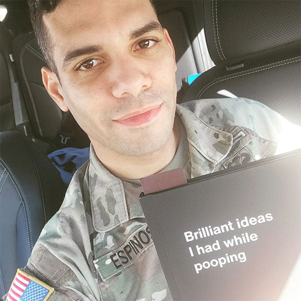 A US soldier posing with his WTF Notebook