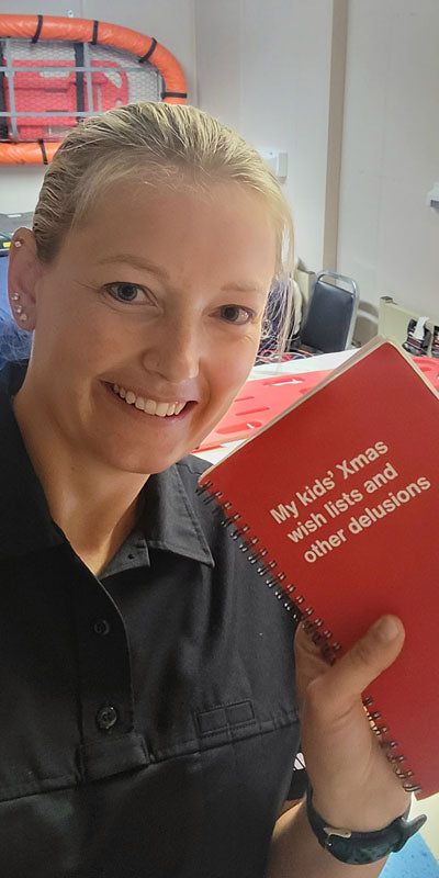 A happy customer posing with her WTF Notebook