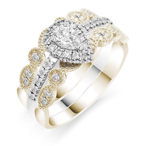 Silva's teardrop diamond ring paired with shapely chrysanthemum edged diamond rings