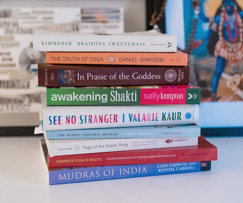 A stack of educational yoga books