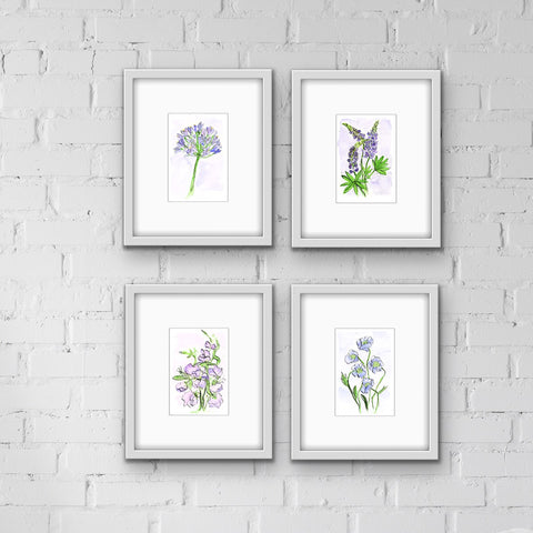 Framed watercolor floral prints in a group of 4 all in shades of purple