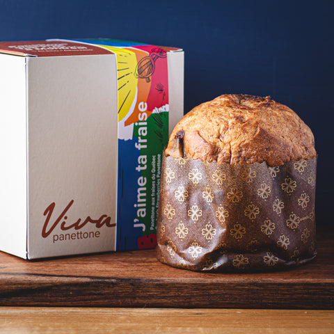 A 500 g Candied Strawberry Panettone sitting next to a box at TOMME Cheese Shop.