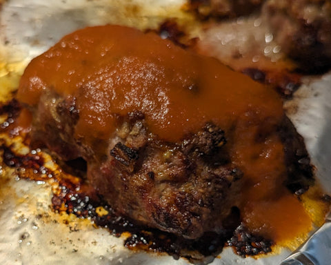 Baked mini meatloaves with a ketchup glaze.