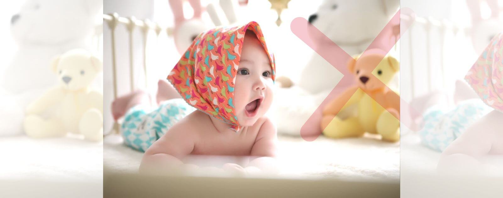 Baby and Cuddly Toys in a Cradle