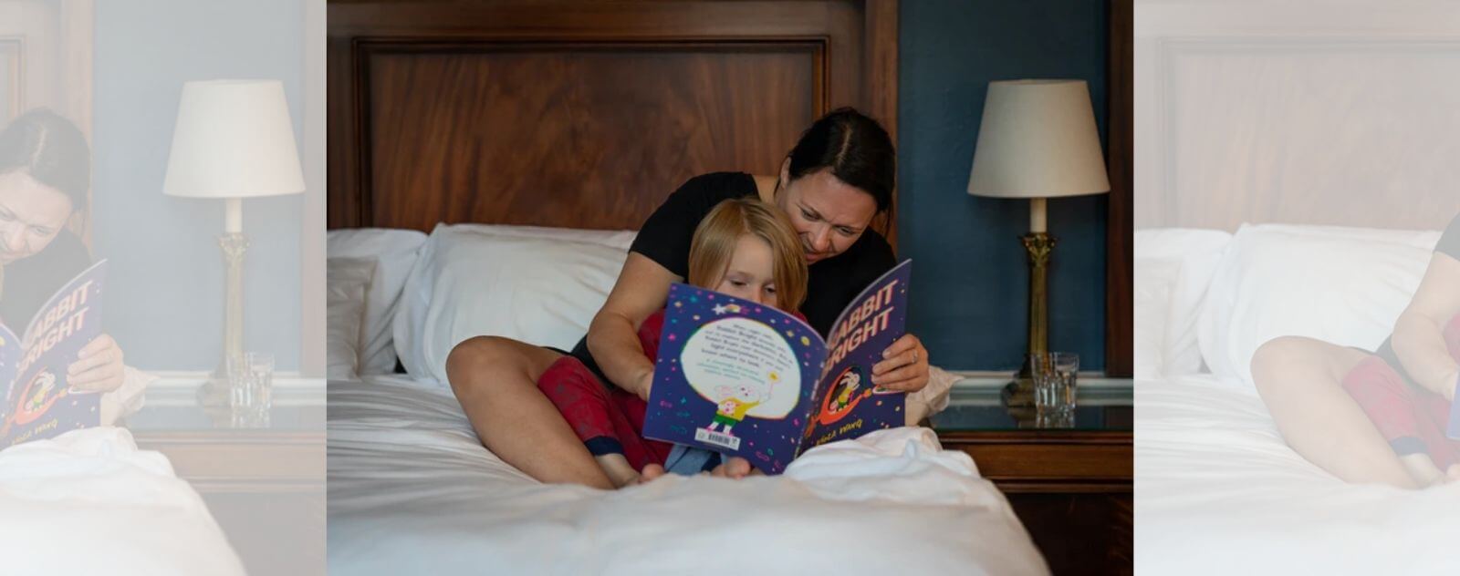 Mom Reading a Magical Story in the Evening to Her Child in Bed to Put Him to Sleep
