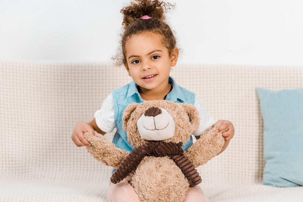 Little girl and her stuffed animal