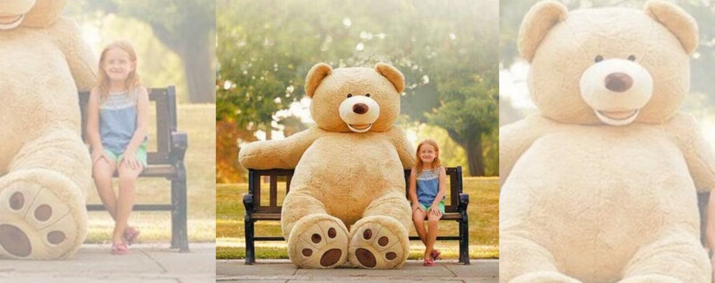 Giant teddy bear sitting on a bench with a little girl