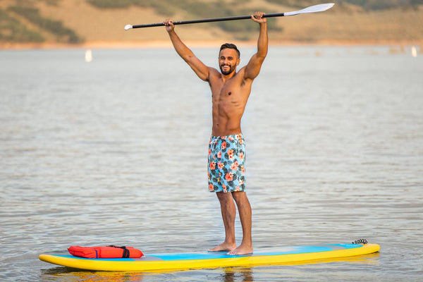 fit man on a paddle board