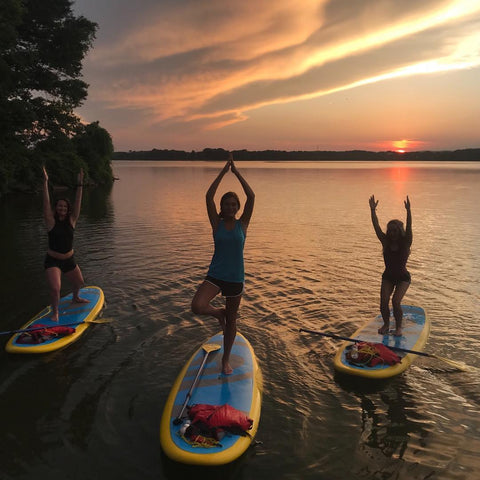 sup yoga at sunset