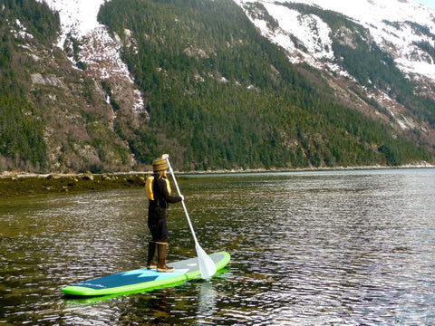 child on a paddle board in alaska