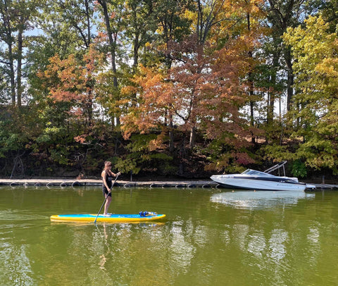 paddling a stand up paddle board