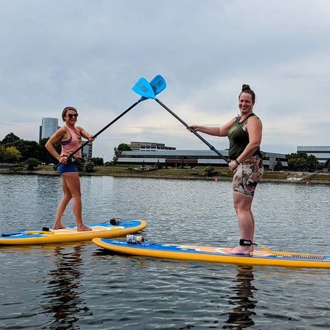 women on paddle boards