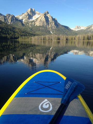paddle board on a lake in idaho