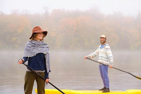 couple on paddle boards