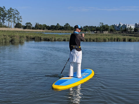 woman on stand up paddle board