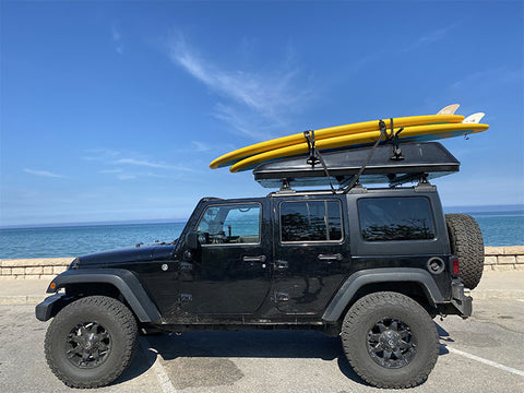paddle boards on a jeep