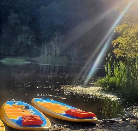 solid paddle boards on a lake