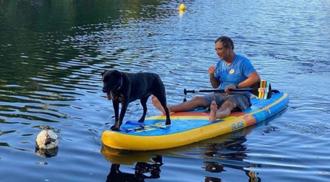 dog on inflatable paddle board