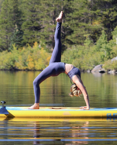 sup yoga on an inflatable paddle board