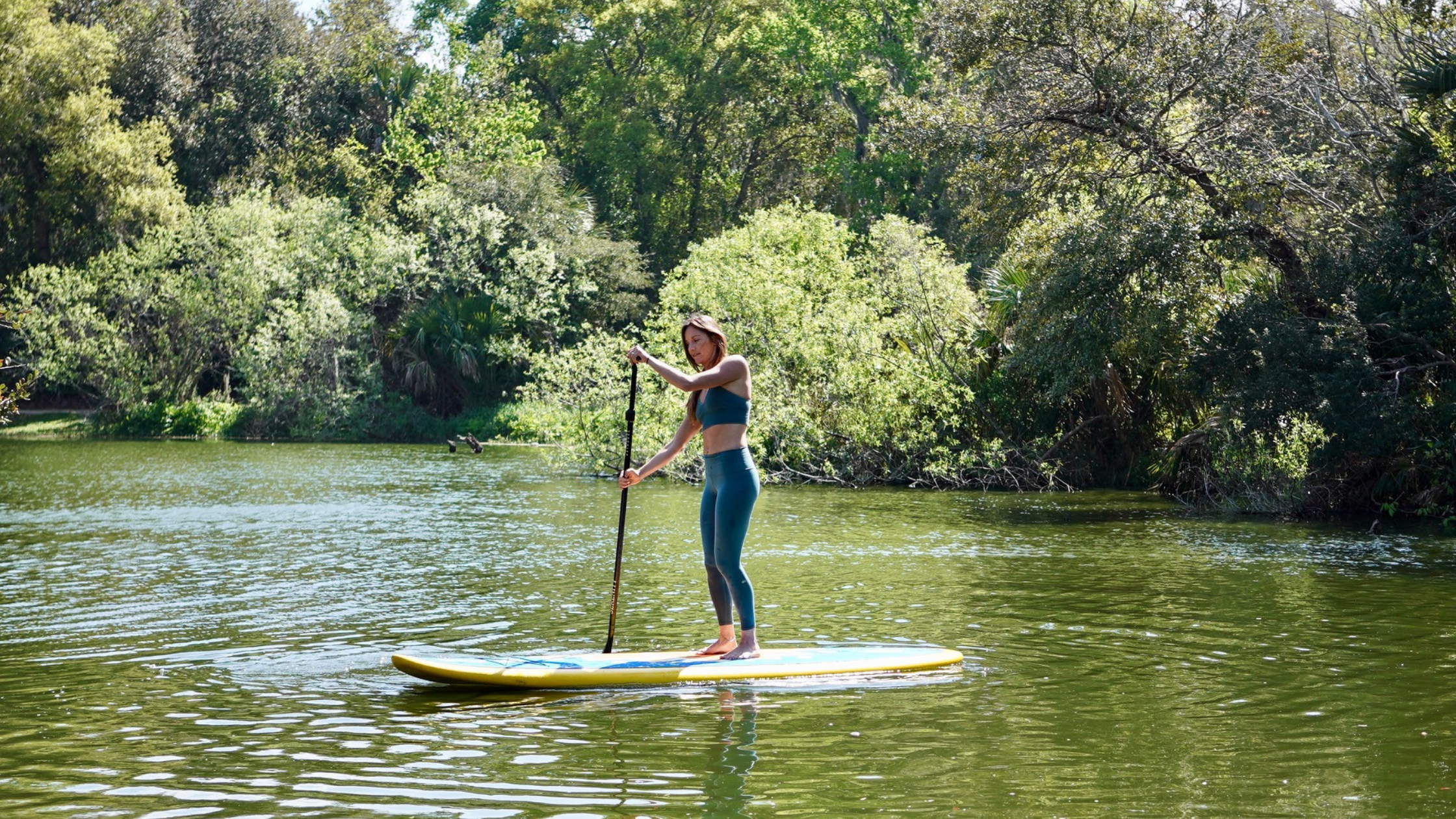 woman on glide stand up paddle board