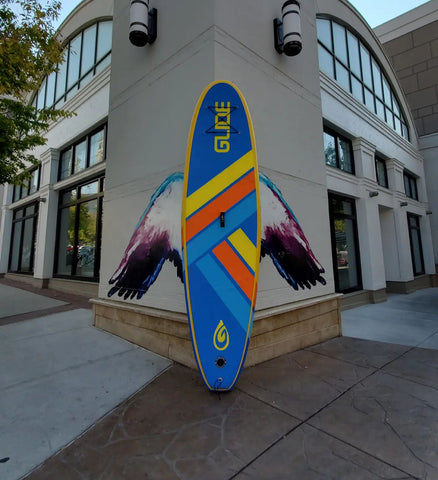 inflatable paddle board against a building