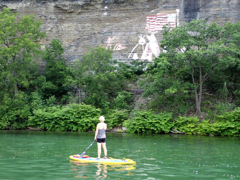 woman on stand up paddle board