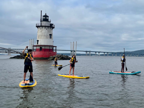 paddle boards on the hudson river