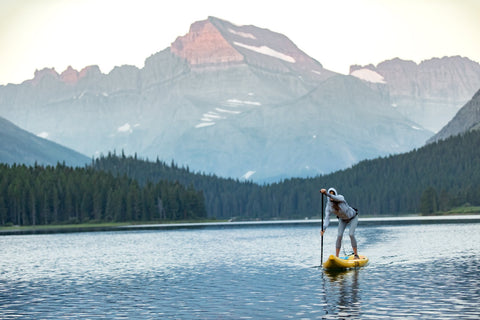 woman paddling inflatable paddle board