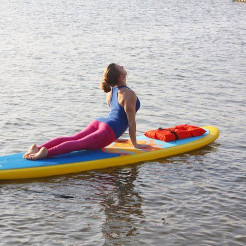 sup yoga on a paddle board