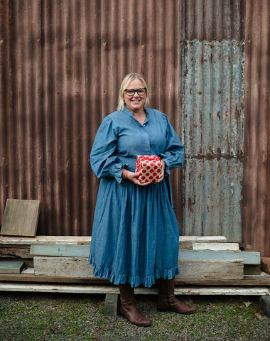 Jane with gift wrapped in red spotty paper