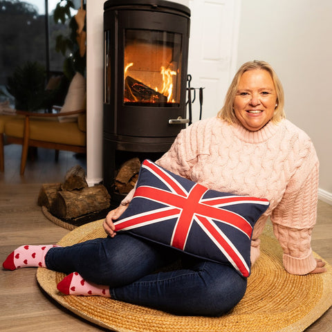 Jane holding Union Jack cushion, the perfect gift for British in Australia