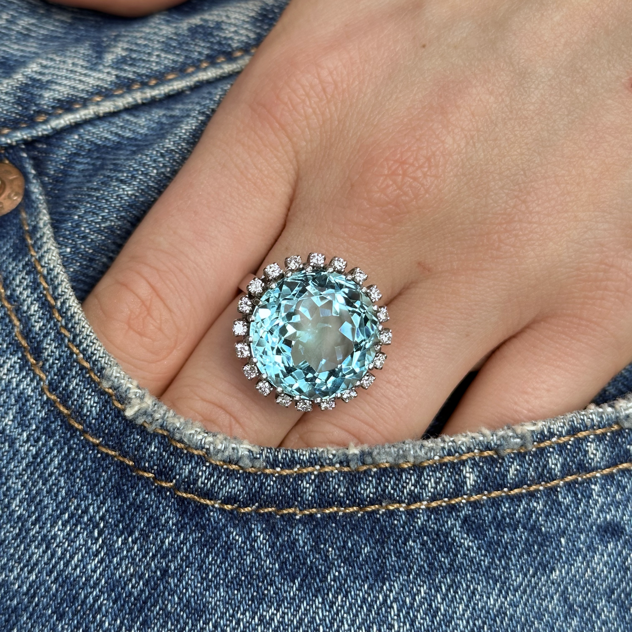 20ct Aquamarine and Diamond Cluster Ring, 18ct White Gold, Circa 1970 worn on hand in pocket of jeans
