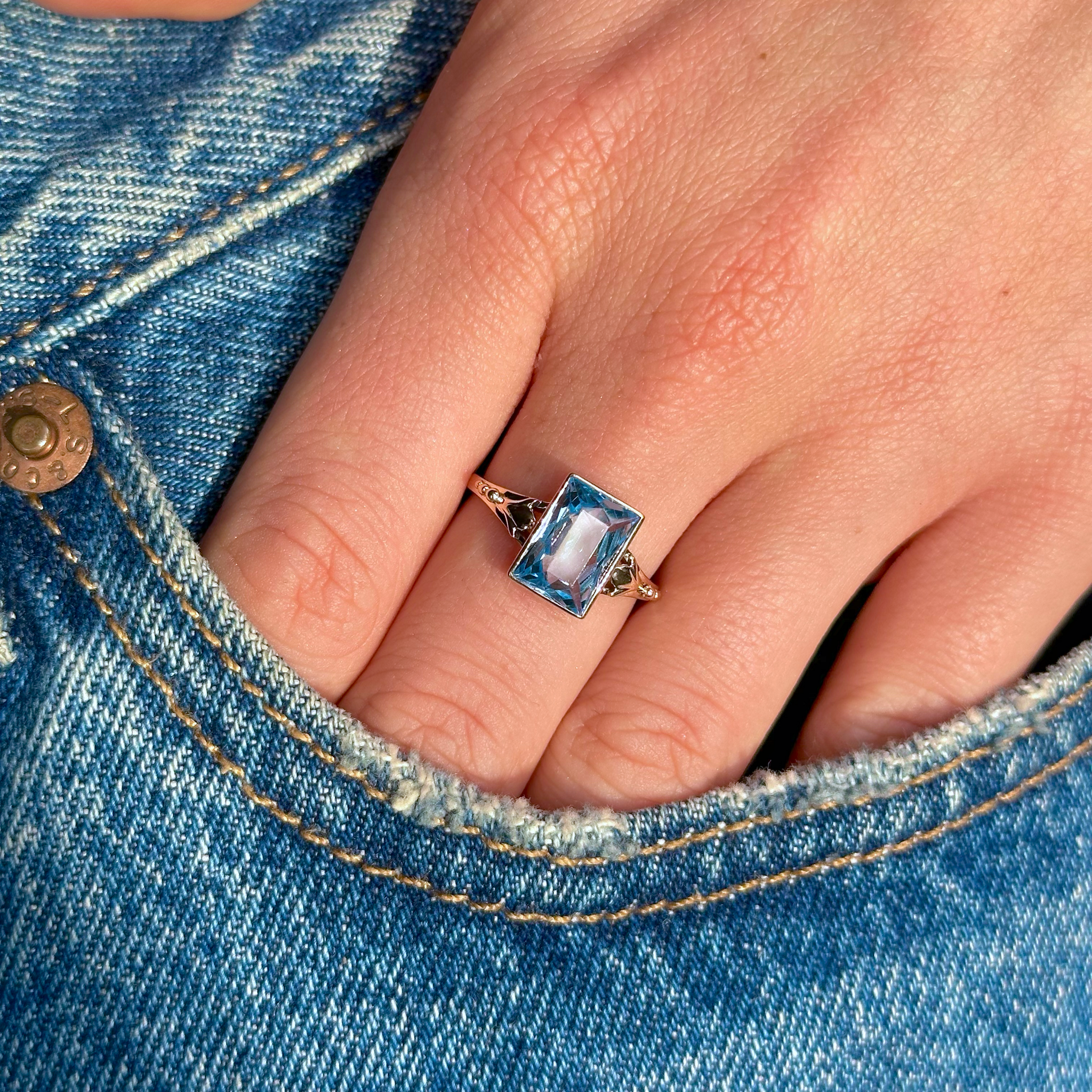 aquamarine single stone ring worn on hand